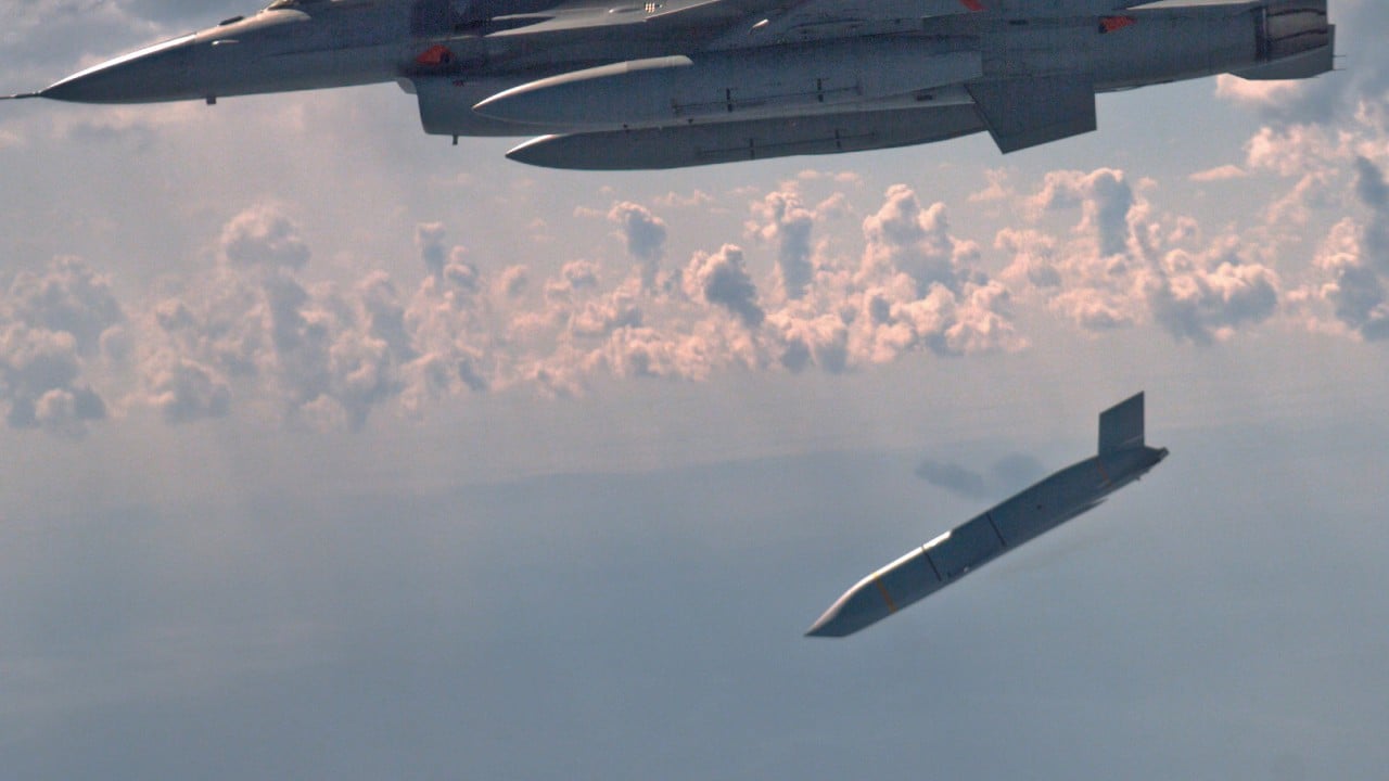 A U.S. stealth cruise missile mounted on a military aircraft preparing for operations