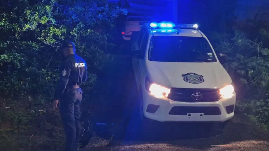 Police tape or emergency response outside a building in Colón after an armed attack