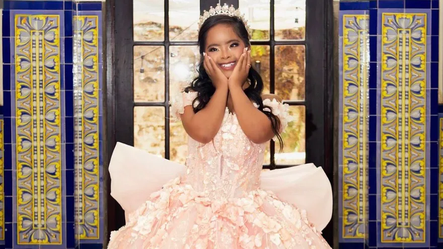 A Panamanian family celebrating a quinceañera with festive decorations and a young woman in a formal dress