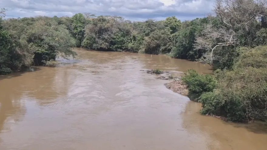 Dark storm clouds and heavy rain over a rural area in Panama, with roads and hills at risk of flooding and landslides