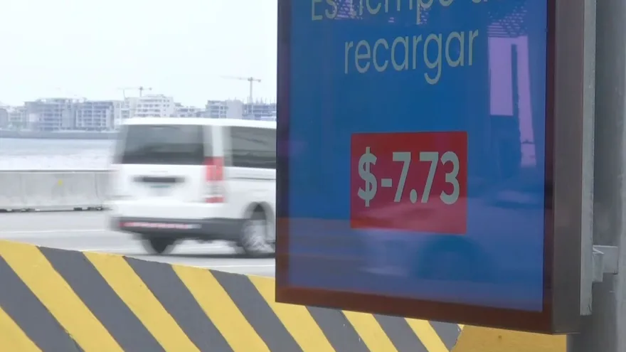 Highway corridor toll signs and information screens warning drivers about unpaid toll balances in Panama