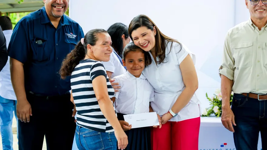 Children and officials during a scholarship distribution event in Panama