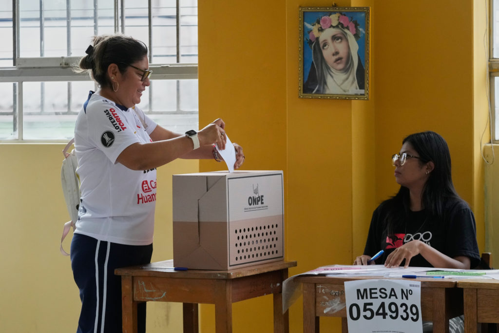 Voters standing in line outside a polling station in Peru during an extended election day