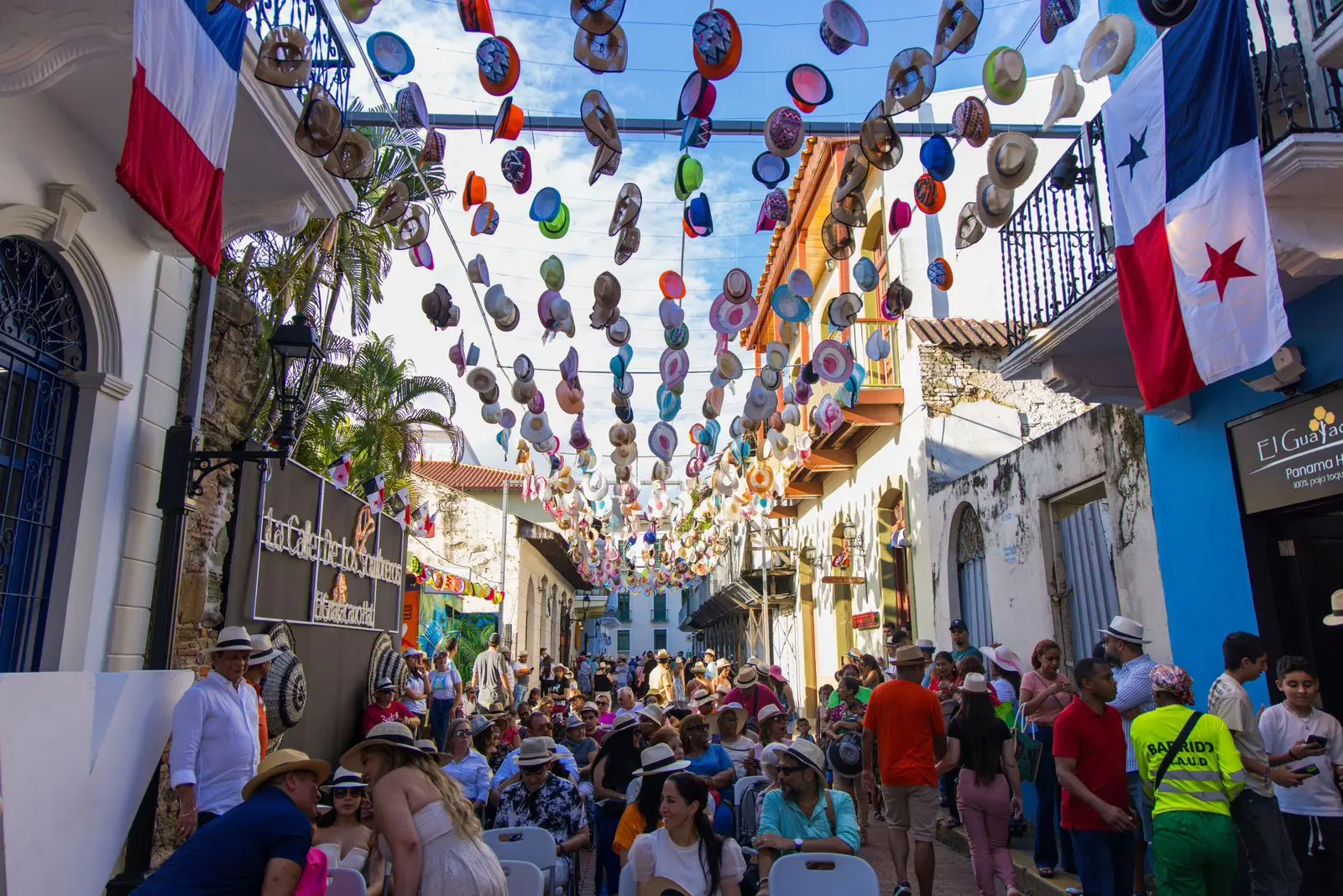 People walking and gathering in Panama City's Casco Antiguo pedestrian zone with historic buildings and active street life
