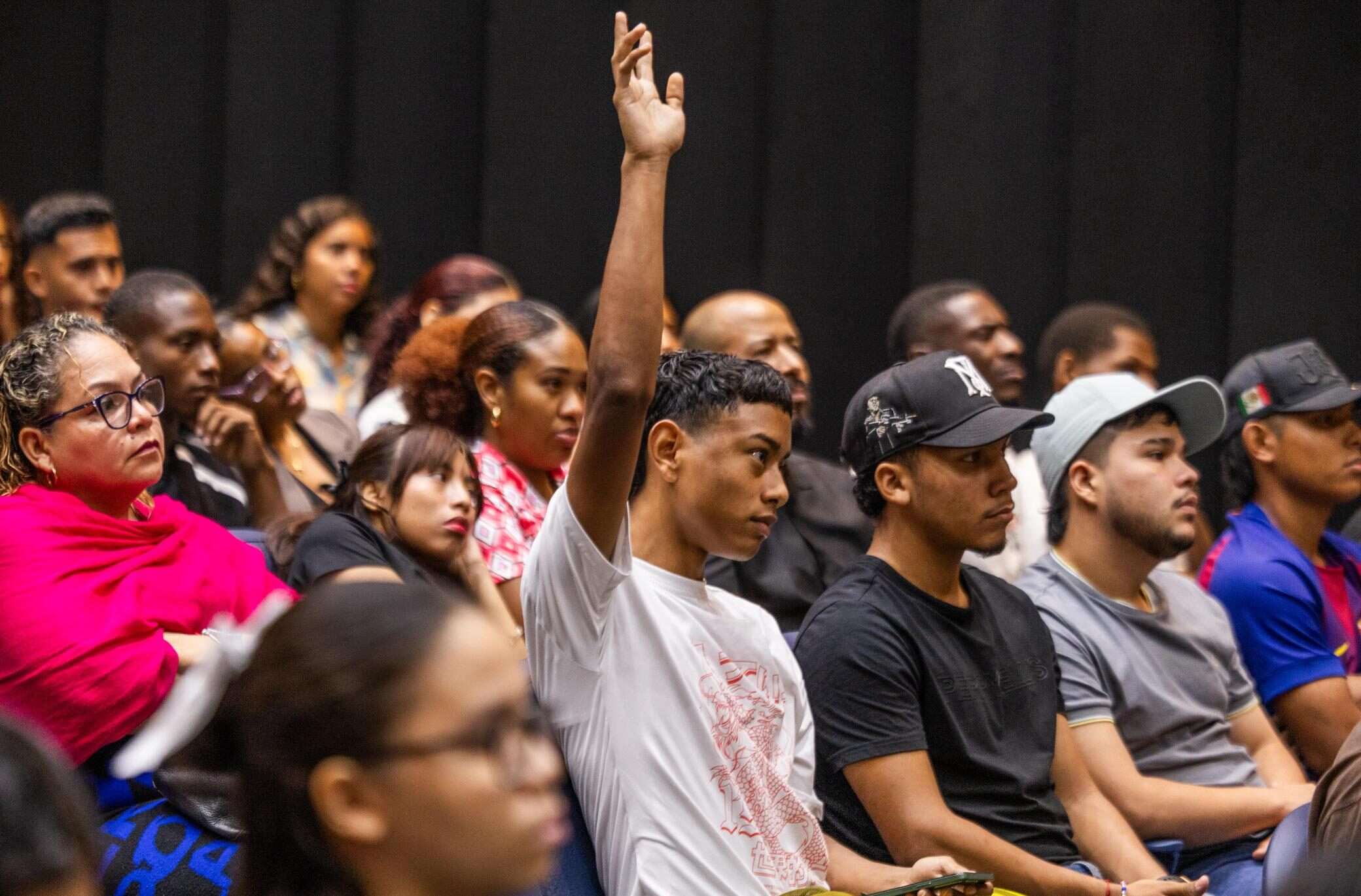 Panama City Mayor Mayer Mizrachi speaking at a launch event for a youth digital training program with attendees seated nearby
