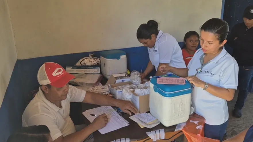 Health workers or a public health team in a rural Panamanian community monitoring malaria prevention efforts