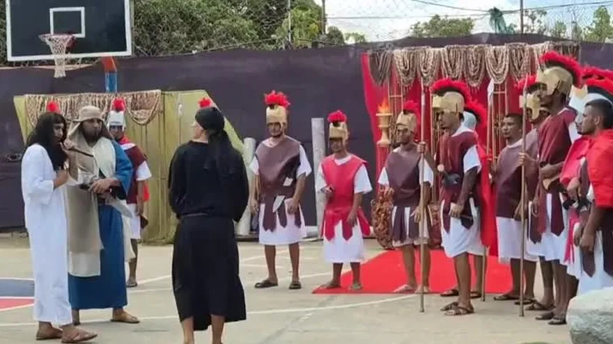 Inmates in a prison courtyard performing a Passion of Christ reenactment during Holy Week in Penonomé, Panama