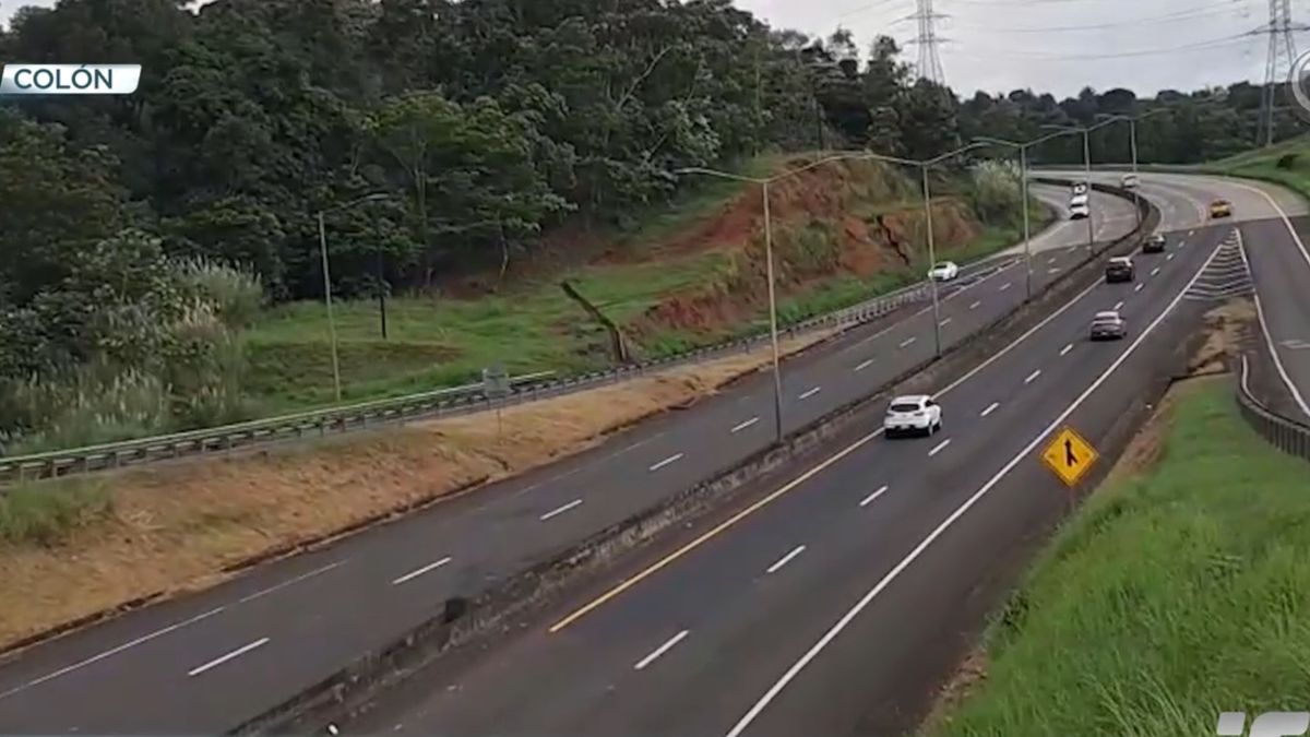 Cyclists riding on a major highway in Panama during an organized road race with traffic control in place