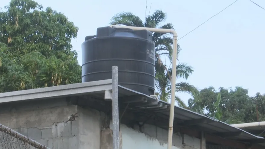Residents in Costa del Sol using rooftop pipes and storage tanks to collect rainwater during a prolonged water shortage