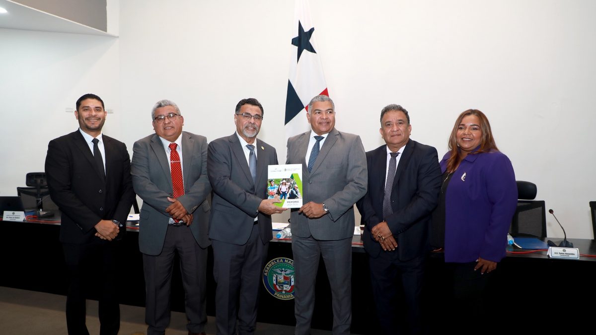 Agricultural producers in Panama working in a rural field with farm equipment and crops in the background
