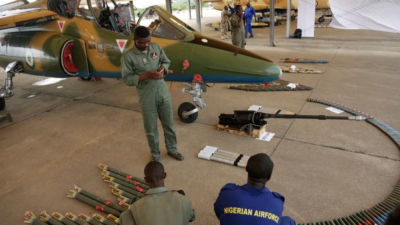 Military aircraft flying over a rural market area in northeast Nigeria after a deadly air strike