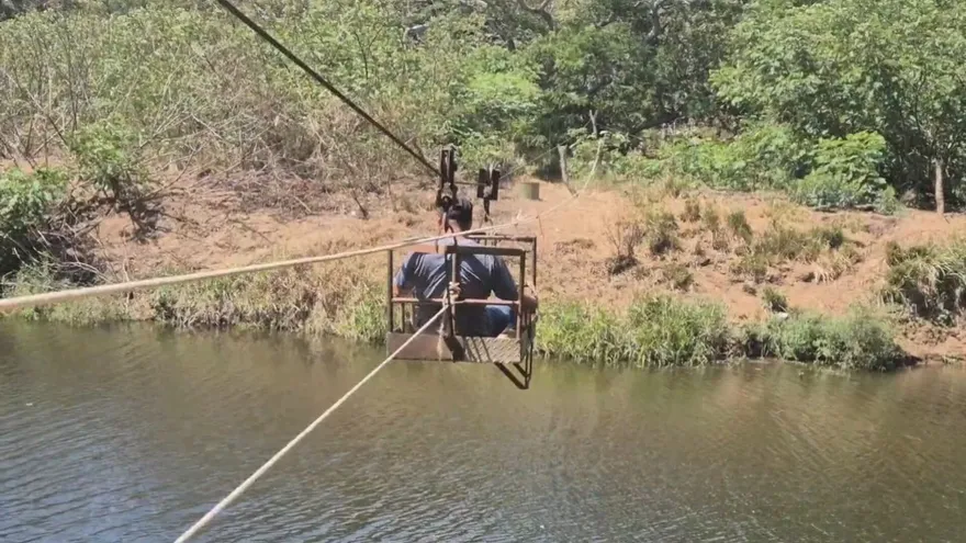 Residents carefully crossing water on an improvised carricoche in Parita, Panama