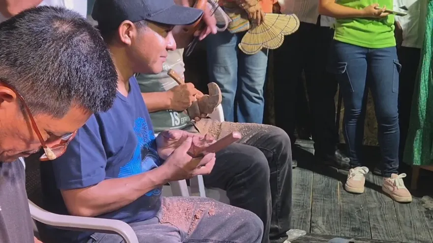 Artisans carving soapstone during a cultural festival in Coclé, Panama