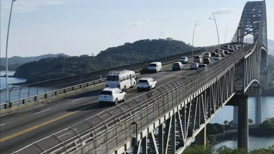 The Bridge of the Americas spanning the Panama Canal with traffic moving across it during a structural inspection
