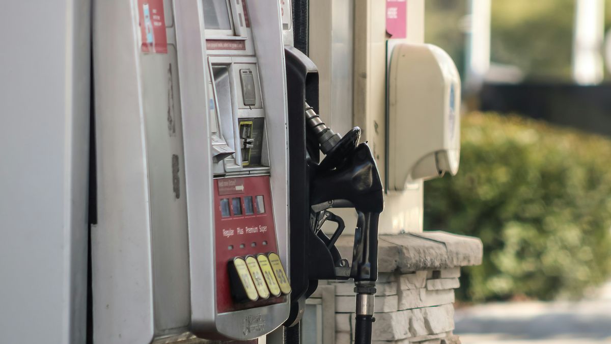Transport workers in Panama at a fuel station preparing to use a fuel subsidy benefit