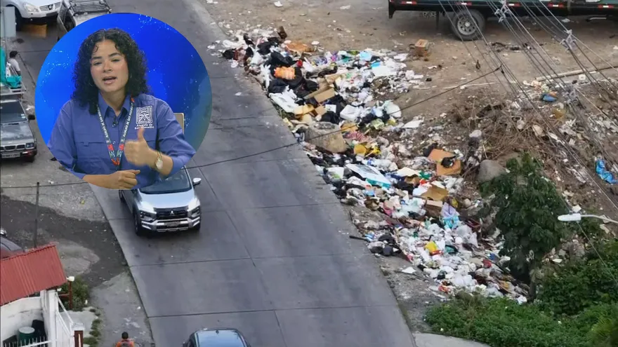 A street in San Miguelito with waste containers and municipal workers amid an urban neighborhood