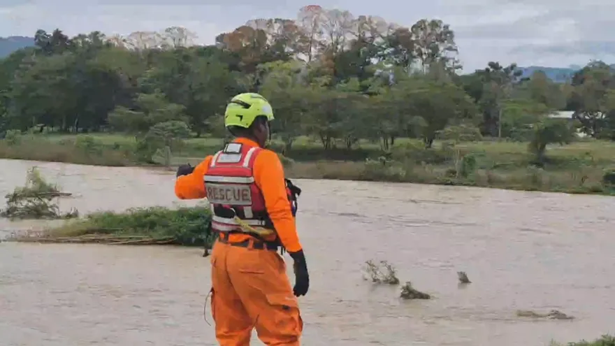 A swollen river in western Panama flowing near a rural community after heavy rainfall