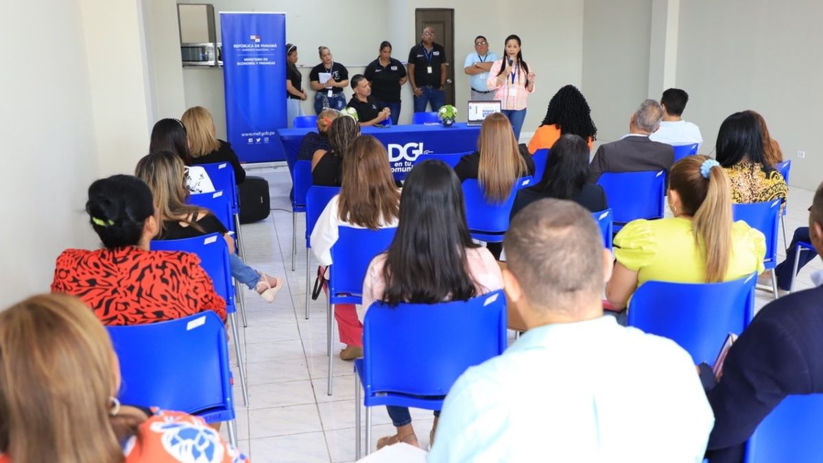 A taxpayer service office in Panama with people handling administrative paperwork and compliance documents