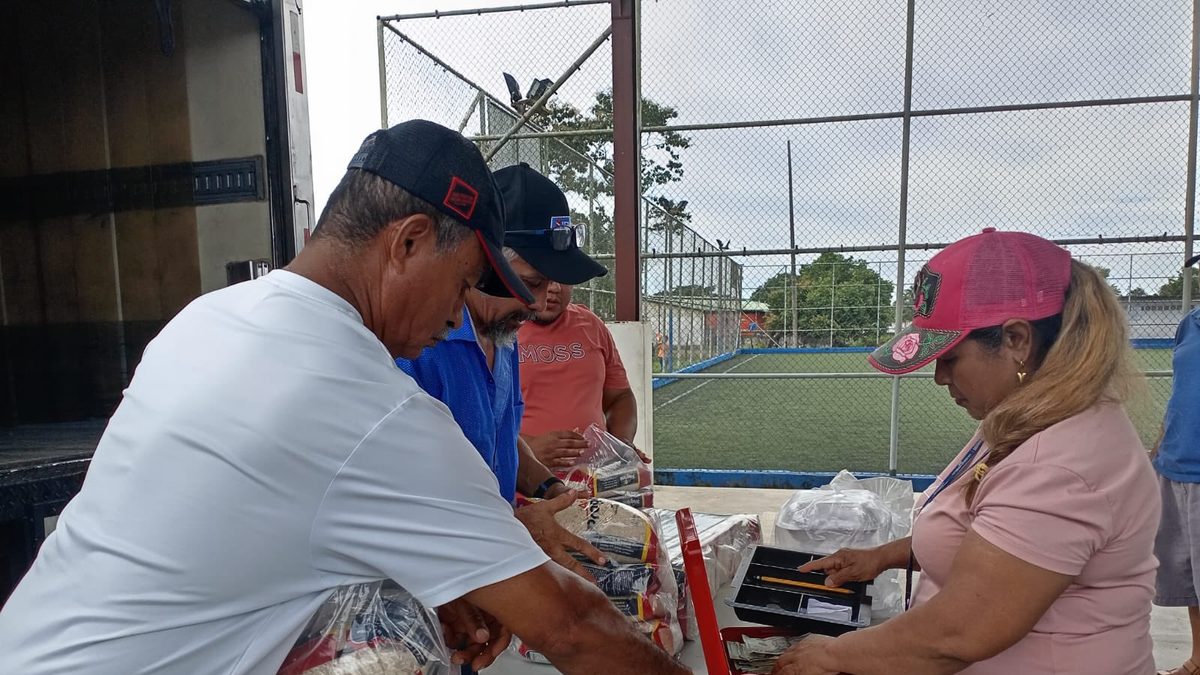 Shoppers buying fresh fruits and vegetables at an agro-fair in Panama