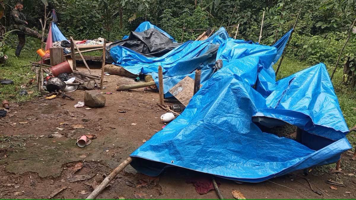 Security officers near an illegal mining camp with seized pumps, tools, and containers in the Darién province of Panama