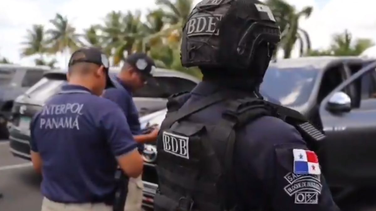 Police officers conducting an arrest operation in Albrook, Panama City, amid an investigation into drug and arms trafficking