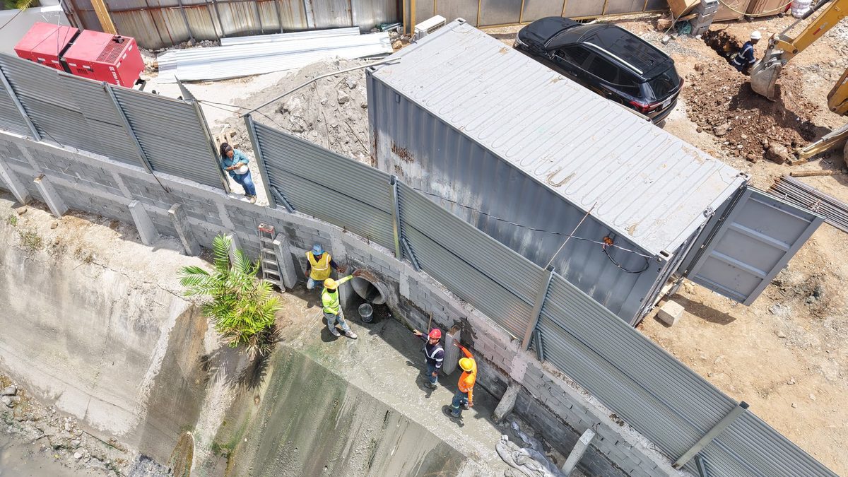 Construction equipment and a development site in Marbella, Panama City, near an area under environmental inspection