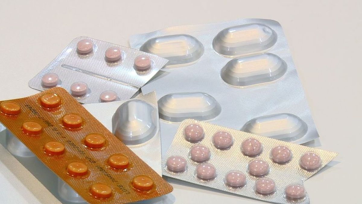 Medical supplies and medicine boxes stored on shelves inside a public health warehouse or pharmacy