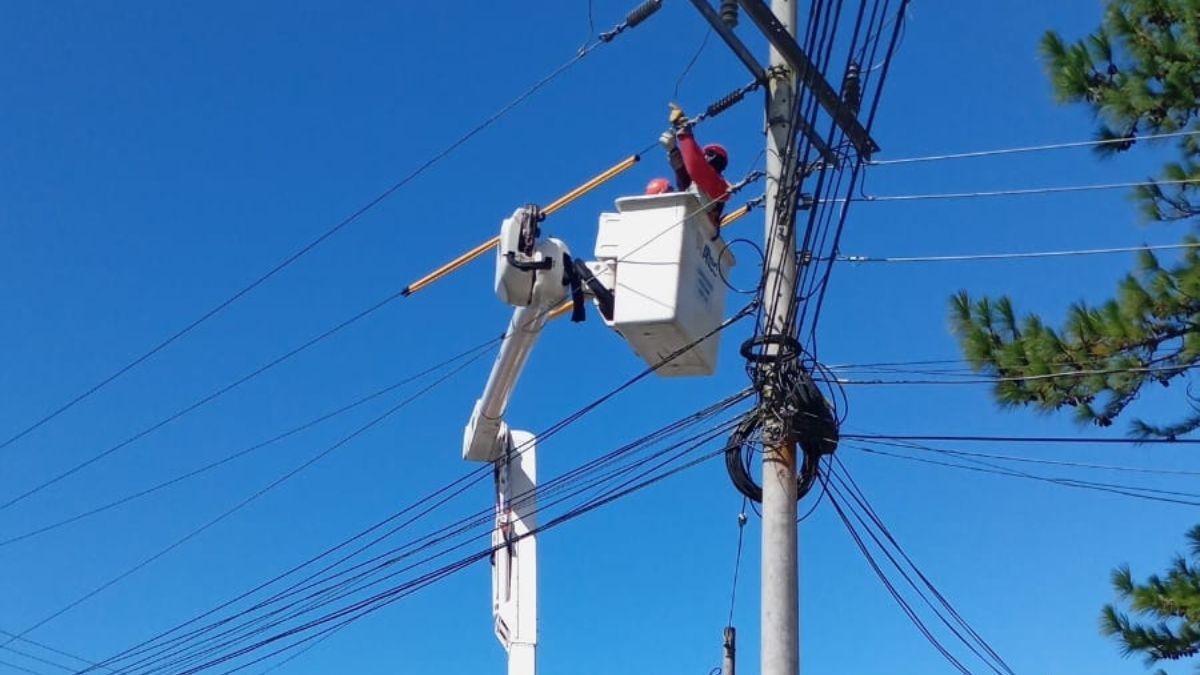 Utility workers inspecting electrical equipment during planned maintenance in Panama