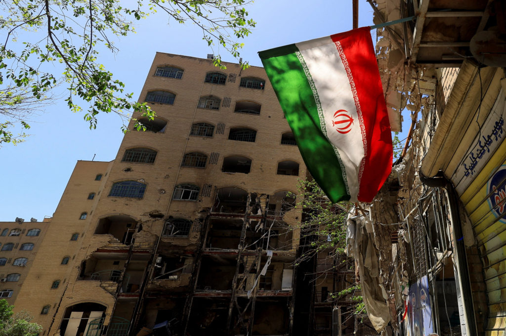 People walking in a busy Tehran street as regional tensions and war fears grow