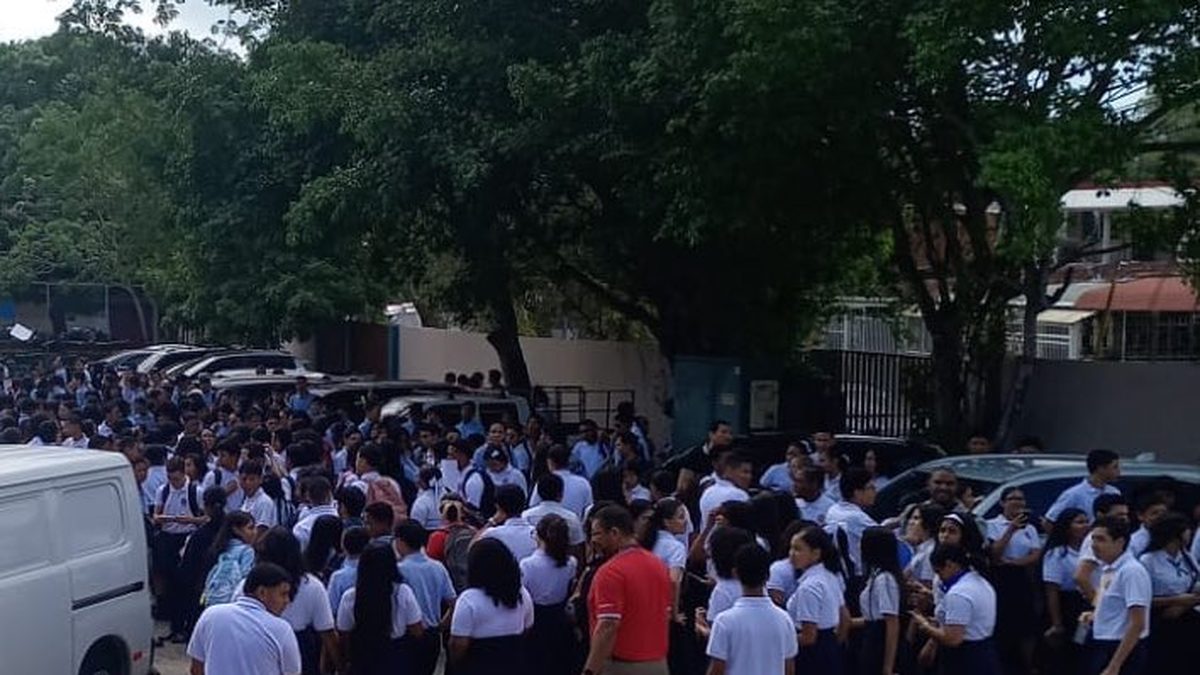 Civil protection personnel assisting a school emergency drill in Panama