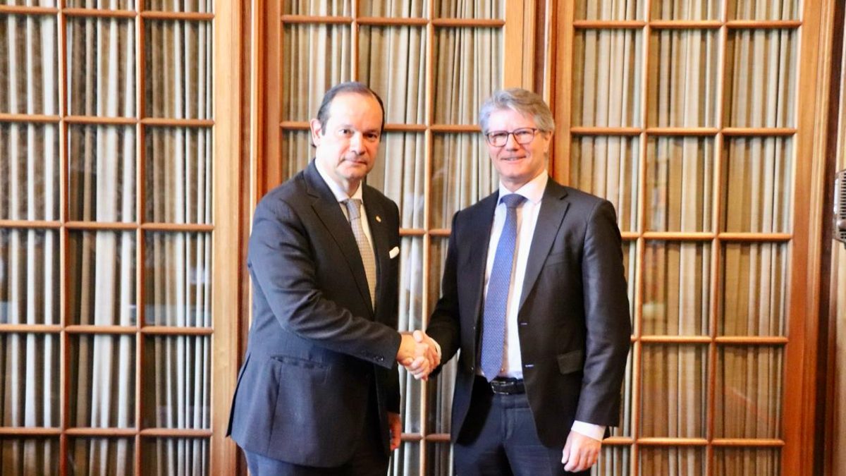 Officials or academics discussing the Panama Canal in a formal conference setting
