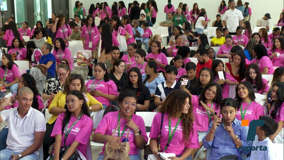 Panamanian girls and mentors presenting technology projects at a community innovation event