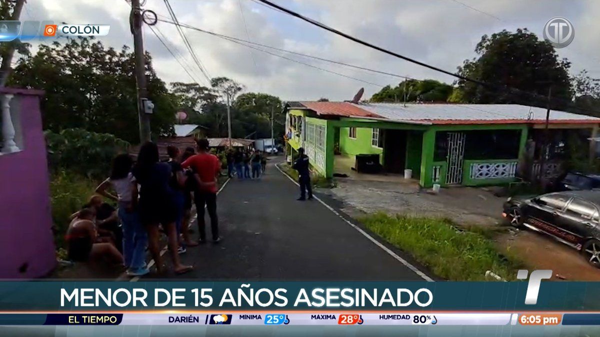 Police tape and officers at a residential street in Sabanitas, Colón, following a shooting