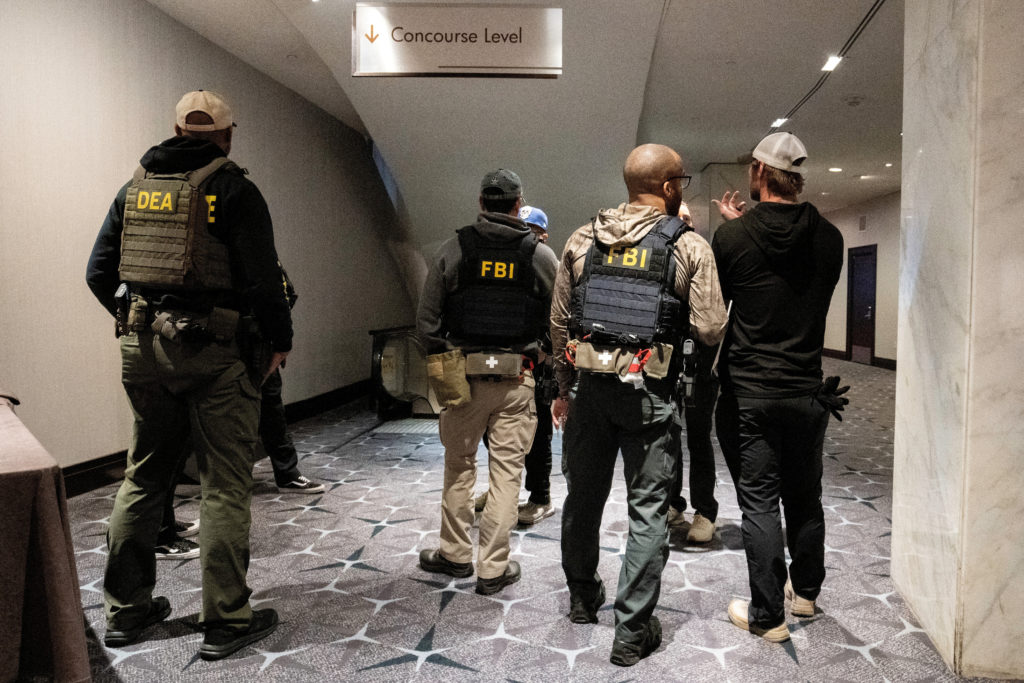 Surveillance footage showing a man running through a security checkpoint near the White House Correspondents' dinner