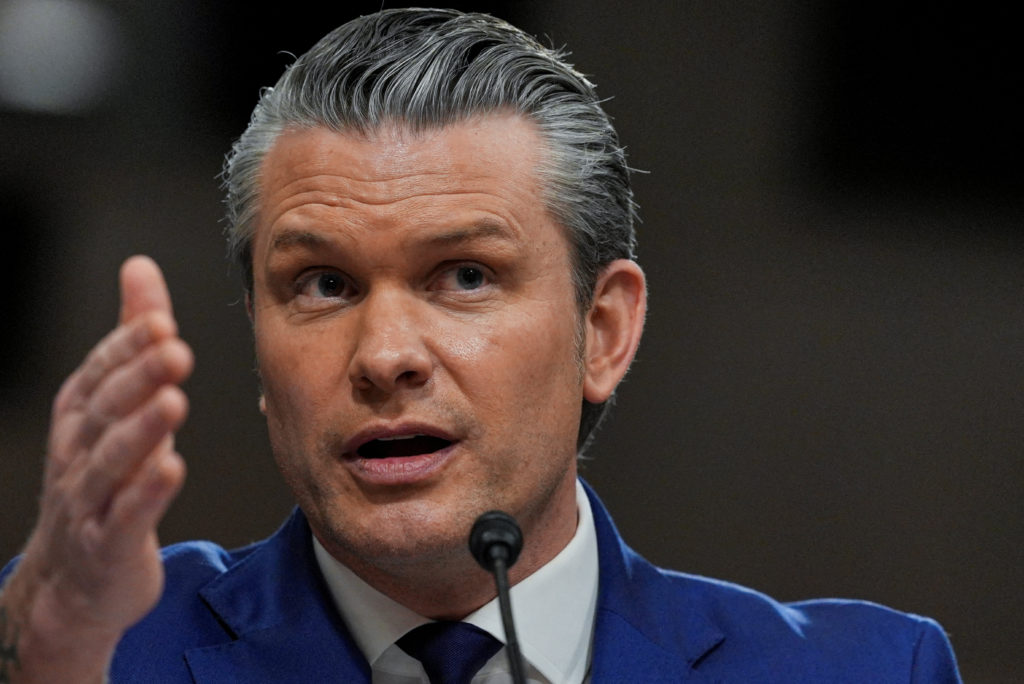 Defense Secretary Pete Hegseth testifying before members of Congress during a defense hearing