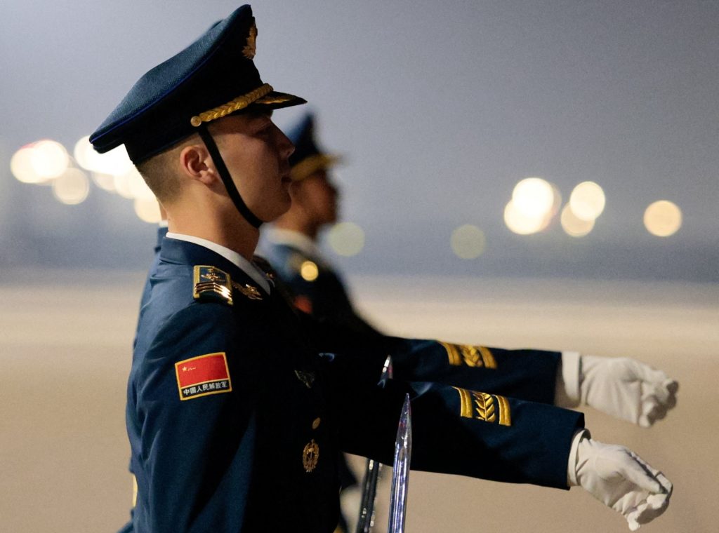 Chinese officials and honor guards preparing for a presidential arrival ceremony in Beijing