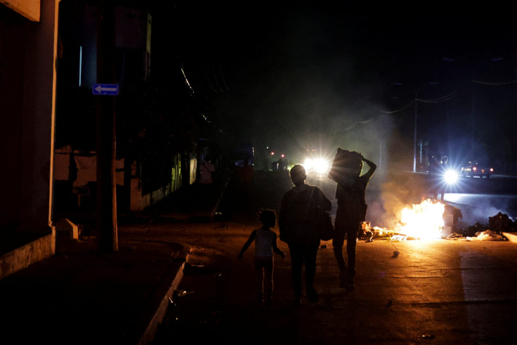 A dark street in eastern Cuba during a widespread power outage with homes and buildings without electricity