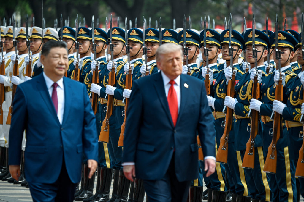 Chinese and U.S. flags displayed near a summit meeting between Xi Jinping and Donald Trump in Beijing
