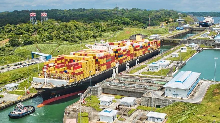 Panama Canal locks with a large cargo ship passing through the waterway