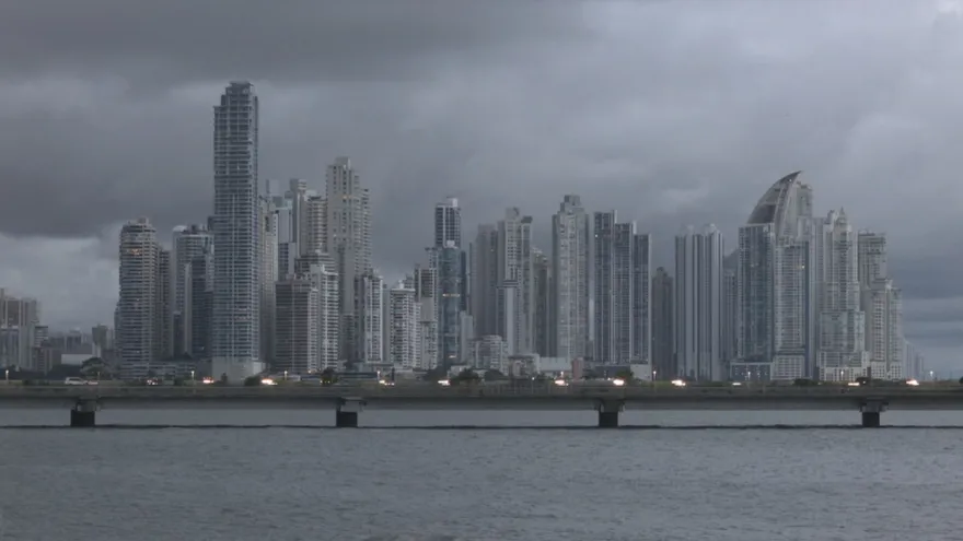 Dark storm clouds and rainfall over a tropical road in Panama during the rainy season