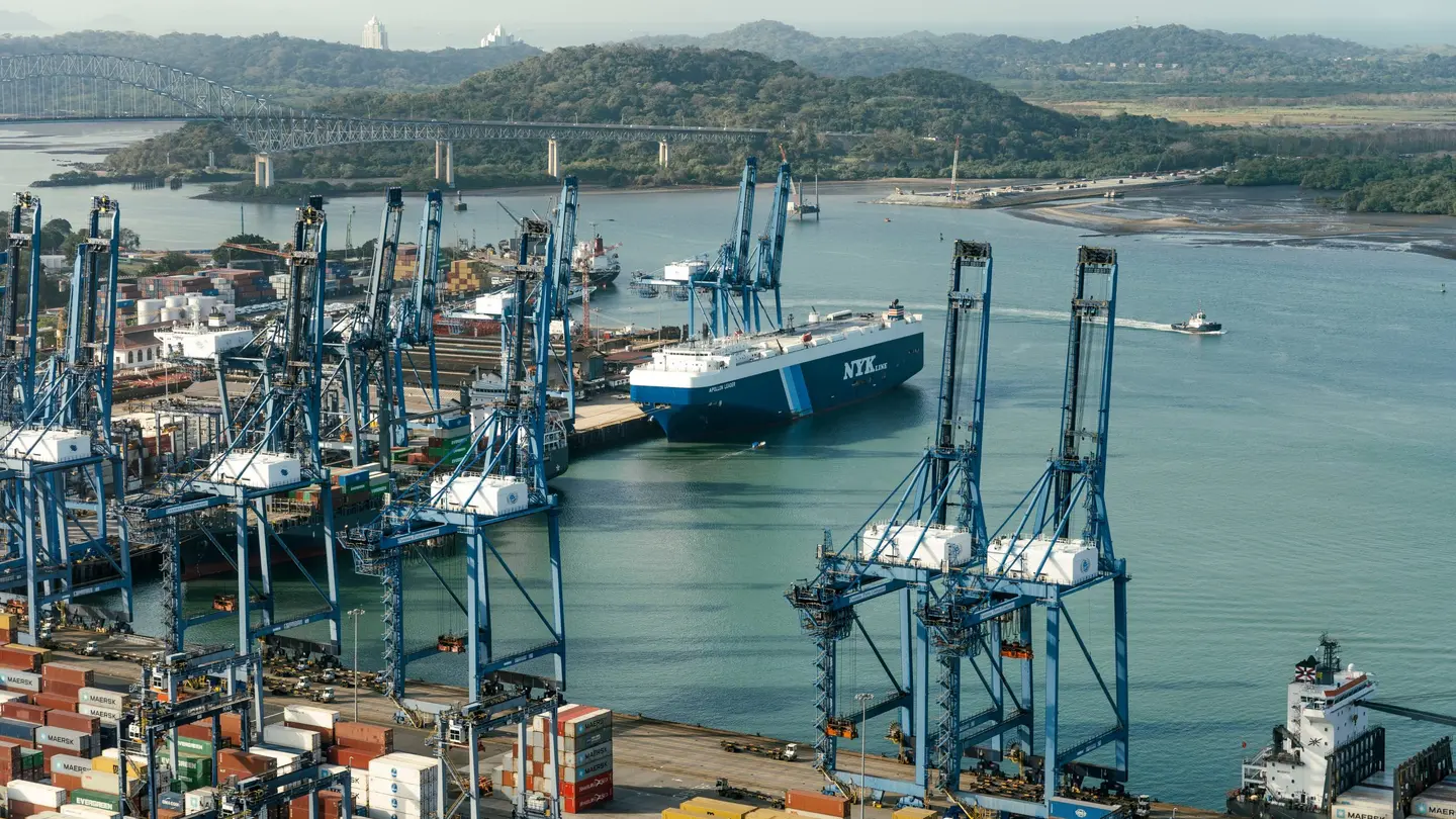 Containers and cranes at the Port of Balboa near the Panama Canal in Panama City with cargo traffic in the background