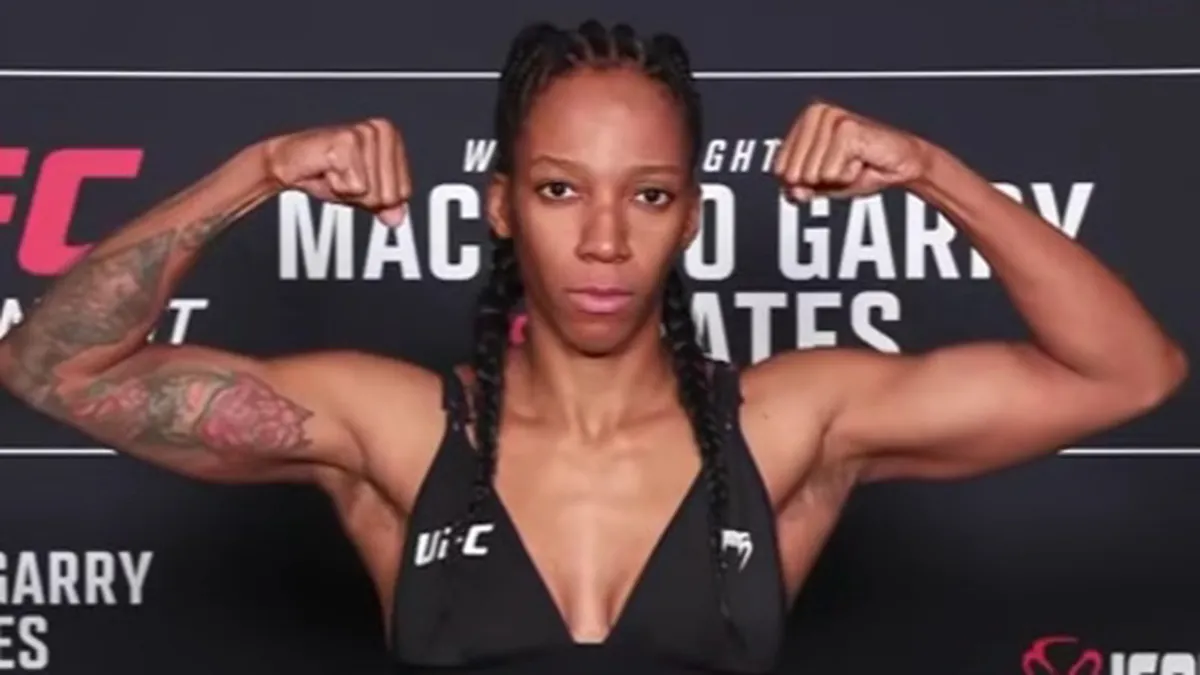 Panamanian UFC fighter Joselyne Edwards standing with the national flag during a public appearance in Panama City