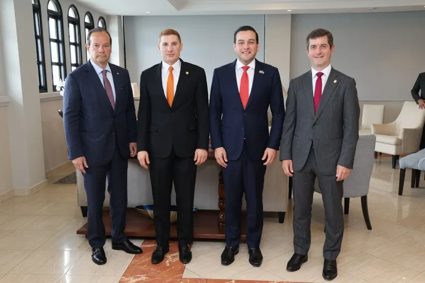 U.S. and Panamanian officials meeting in a formal government office in Panama City to discuss economic cooperation