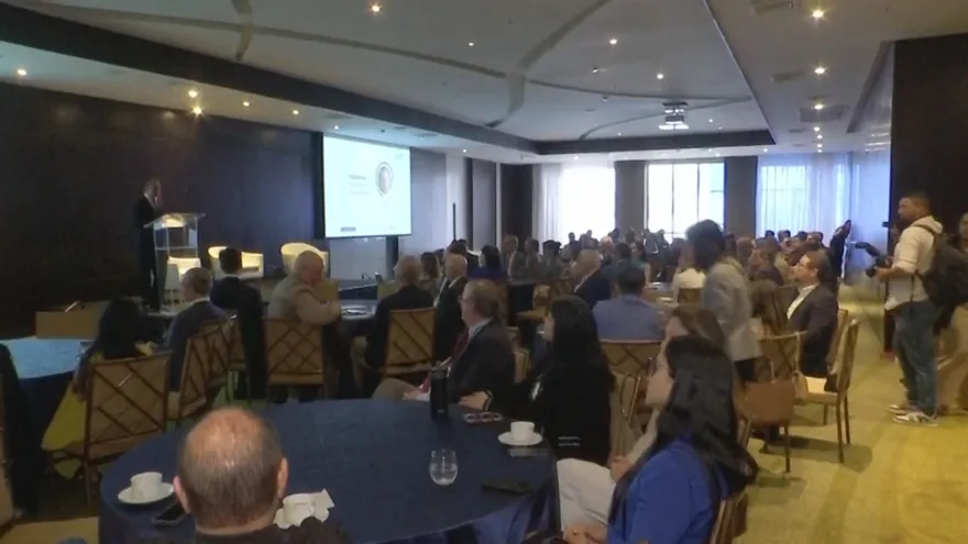 Business and government representatives discussing tax reform and transparency measures at a forum in Panama