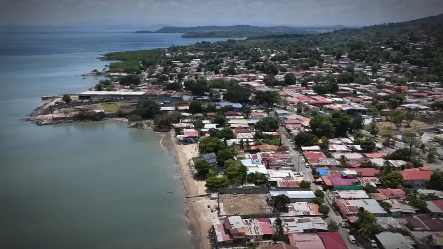 A coastal view of Veracruz in Panama with a sandy beach and calm sea near the shoreline
