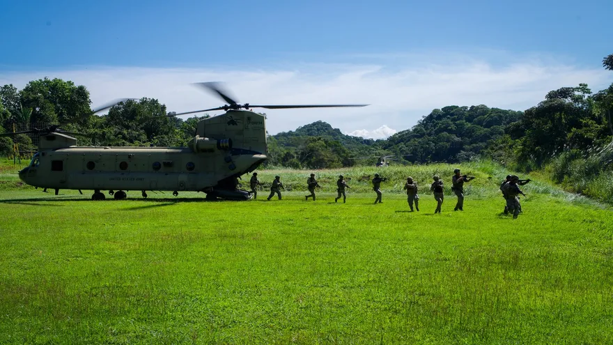 Naval ships and military helicopters operating near the Panama Canal during a multinational security exercise