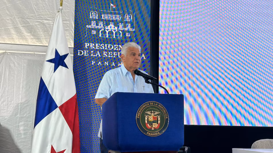 Panamanian President José Raúl Mulino speaking at an outdoor event with a backdrop of Panama’s northern region