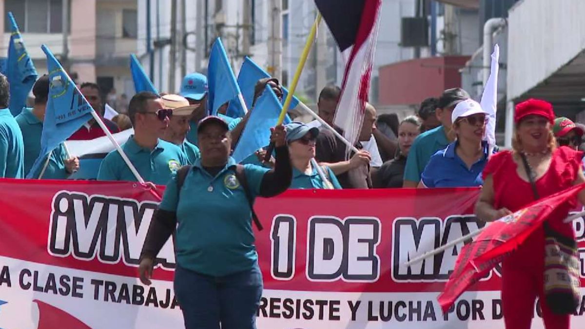Labor union members marching in Panama on May 1 with banners calling for better working conditions